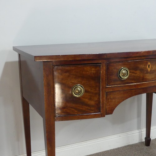 582 - A Regency mahogany bow-front side Table/Desk, of small proportions, the shaped top above three drawe... 