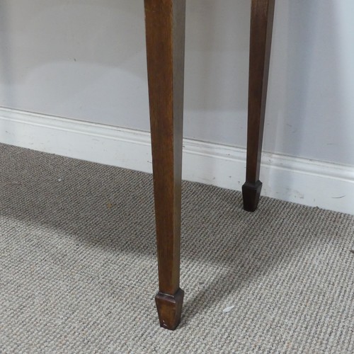 582 - A Regency mahogany bow-front side Table/Desk, of small proportions, the shaped top above three drawe... 