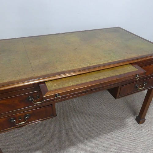 602 - A George III mahogany Desk, the top inset with green gilt-tooled leather writing surface, above brus... 