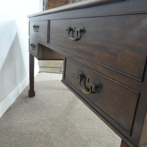 602 - A George III mahogany Desk, the top inset with green gilt-tooled leather writing surface, above brus... 