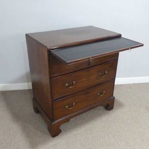 586 - A Georgian mahogany bachelor's Chest of drawers, fitted with brushing slide over two short and two l... 