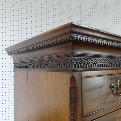 573 - A George III mahogany Chest on Chest, the upper section with a carved and moulded cornice and frieze... 