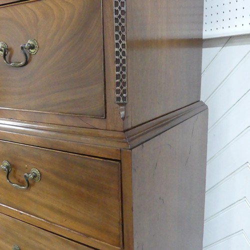 573 - A George III mahogany Chest on Chest, the upper section with a carved and moulded cornice and frieze... 