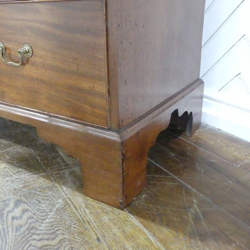 573 - A George III mahogany Chest on Chest, the upper section with a carved and moulded cornice and frieze... 