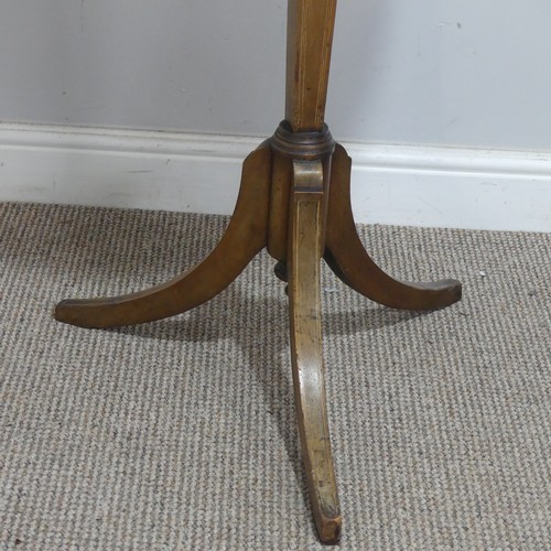 629 - A Georgian mahogany Shaving Stand, the shield swing mirror on telescopic stand, raised on tripod tab... 