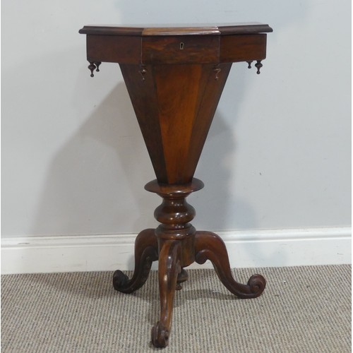 637 - A late 19th century mahogany sewing Table, the octagonal hinged top enclosing a fitted interior, rai... 