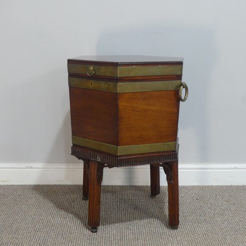 610 - A George III mahogany hexagonal brass bound Cellarette, the hinged lid opening to a lead lined inter... 