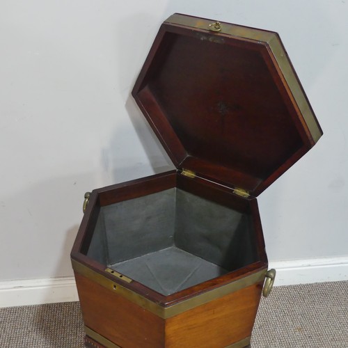 610 - A George III mahogany hexagonal brass bound Cellarette, the hinged lid opening to a lead lined inter... 