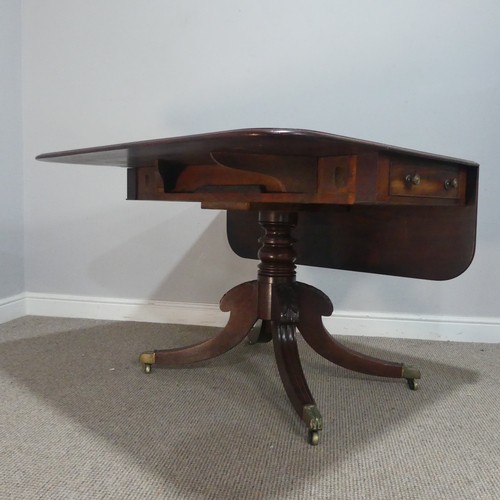 607 - A 19th century mahogany Pembroke Table, raised on turned column and carved splayed quadraform base, ... 