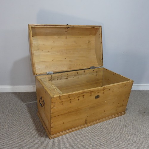 677 - A pine domed top Trunk, with carrying handles to either side, W 100 cm x H 65 cm x D 58 cm.... 