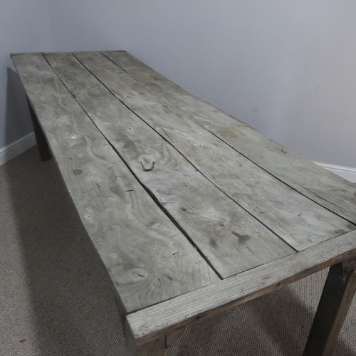 620 - A 19th century French elm weathered kitchen farmhouse Table, the four panel top with cleated ends, r... 