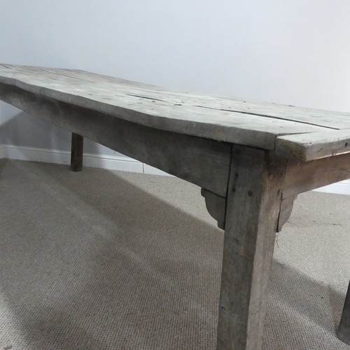 620 - A 19th century French elm weathered kitchen farmhouse Table, the four panel top with cleated ends, r... 