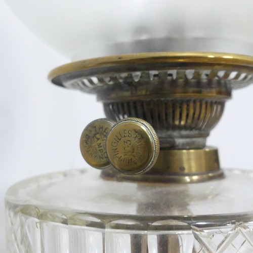 647 - A Victorian Rippingilles duplex No.3 brass Oil Lamp, with cut glass reservoir below etched shade and... 