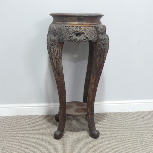 673 - An antique Chinese carved hardwood Plant Stand, the circular top with geometric carved border, raise... 