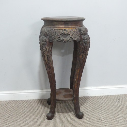 673 - An antique Chinese carved hardwood Plant Stand, the circular top with geometric carved border, raise... 