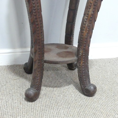 673 - An antique Chinese carved hardwood Plant Stand, the circular top with geometric carved border, raise... 