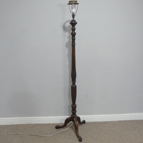 657 - A 19th century carved standard Lamp, carved and reeded column, raised on tripod base and claw ball f... 