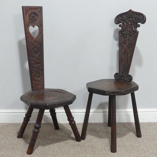 645 - An antique carved oak spinning Chair, shaped backrest with Art Nouveau stylised carvings, W 30 cm x ... 