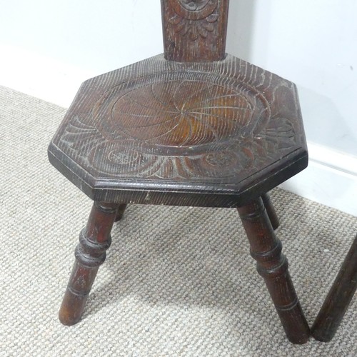 645 - An antique carved oak spinning Chair, shaped backrest with Art Nouveau stylised carvings, W 30 cm x ... 