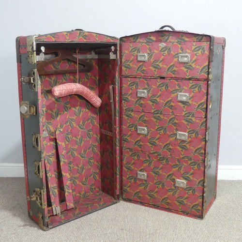 678 - An early 20th century metal bound steamer Wardrobe Trunk, the trunk with brass locks and leather han... 