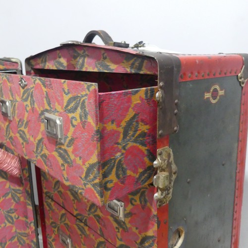 678 - An early 20th century metal bound steamer Wardrobe Trunk, the trunk with brass locks and leather han... 