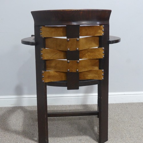 588 - A Glasgow School of Arts and Crafts oak and leather Armchair, the design in the style of George Walt... 