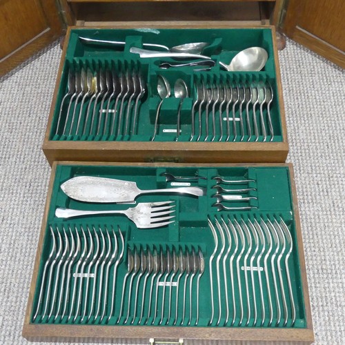 548 - An early 20thC oak Mappin and Webb Canteen of silver plated cutlery, with brass campaign inset handl... 