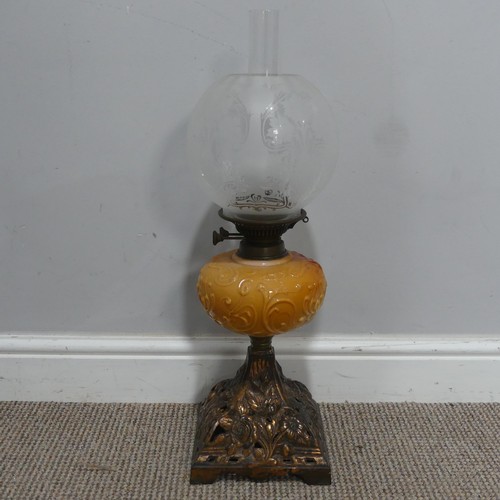 682 - An Art Nouveau Oil Lamp, with orange glass reservoir decorated with stylised flowers, complete with ... 