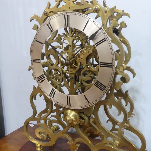 511 - A large 20th century brass skeleton Clock, the silvered chapter ring with Roman numerals, single tra... 