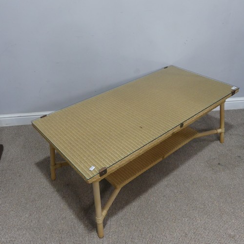 660 - A Lloyd Loom Coffee Table, with glass top and under tier, W 120 cm x H 47.5 cm x D 59 cm.... 