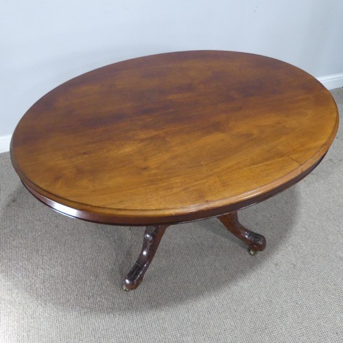 690 - A late 19th century mahogany tilt-top Table, the top of oval form, raised on birdcage and column upo... 