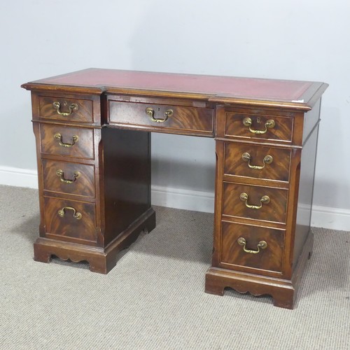 686 - An early 20th century mahogany pedestal Desk, of small proportions, the breakfront top inset with le... 