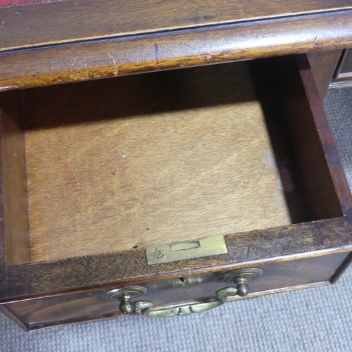 686 - An early 20th century mahogany pedestal Desk, of small proportions, the breakfront top inset with le... 