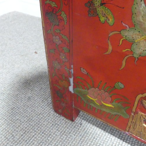 702 - An antique Chinese red-lacquered Cabinet, with two cupboard doors and hinged top compartment, decora... 