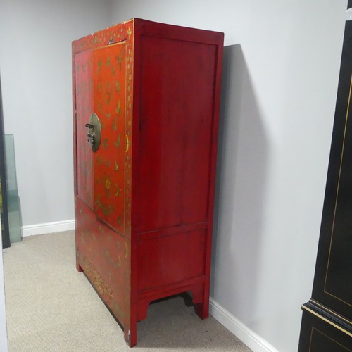 702 - An antique Chinese red-lacquered Cabinet, with two cupboard doors and hinged top compartment, decora... 