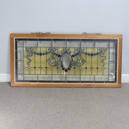 701 - An early 20th century stained glass Panel, mounted in wooden frame, W 136.5 cm x H 65 cm.... 