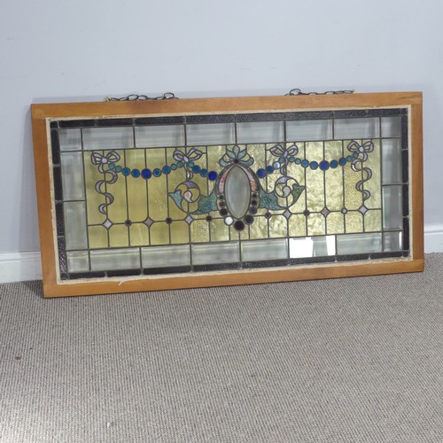 701 - An early 20th century stained glass Panel, mounted in wooden frame, W 136.5 cm x H 65 cm.... 