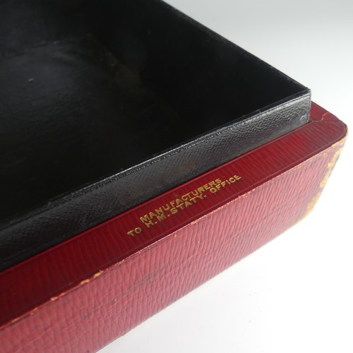 684 - A George V red leather Dispatch Box, manufactured by John Peck and Son, the top embossed with gilt G... 