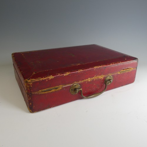 684 - A George V red leather Dispatch Box, manufactured by John Peck and Son, the top embossed with gilt G... 