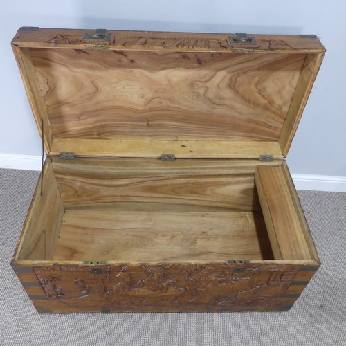 694 - A Chinese carved metal bound camphorwood Chest, with gilt metal inset handles, W 104 cm x H 54.5 cm ... 