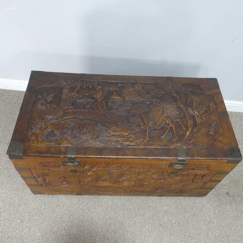 694 - A Chinese carved metal bound camphorwood Chest, with gilt metal inset handles, W 104 cm x H 54.5 cm ... 