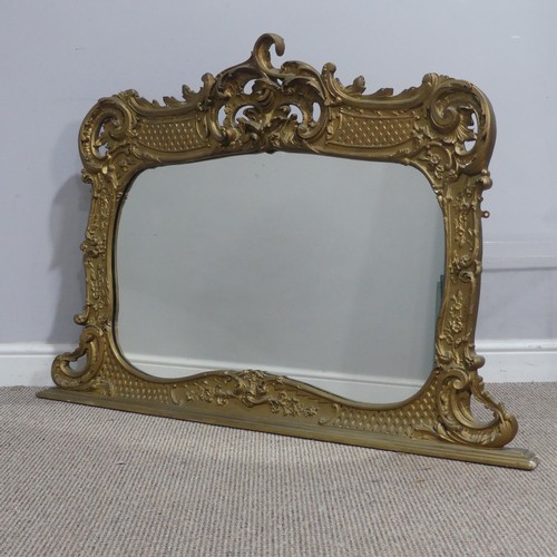 715 - An antique carved gilt painted wall Mirror, the framed carved with scrolled foliate designs, W 119 c... 