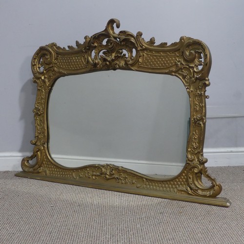 715 - An antique carved gilt painted wall Mirror, the framed carved with scrolled foliate designs, W 119 c... 