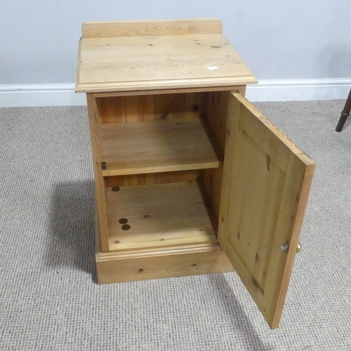 723 - A pine bedside pot Cupboard, W 40 cm x H 64 cm x D 33 cm.