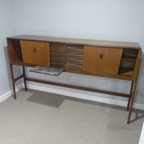 733 - A mid-20th century teak Elliots of Newbury sideboard dining room Set, the sideboard with retracting ... 