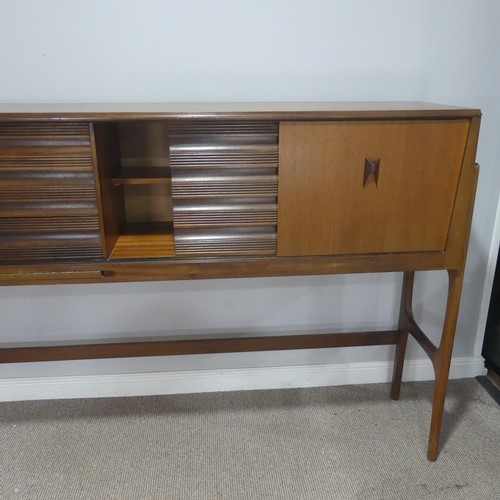 733 - A mid-20th century teak Elliots of Newbury sideboard dining room Set, the sideboard with retracting ... 