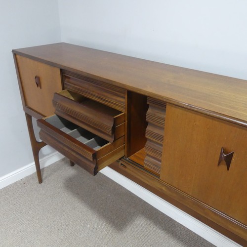 733 - A mid-20th century teak Elliots of Newbury sideboard dining room Set, the sideboard with retracting ... 