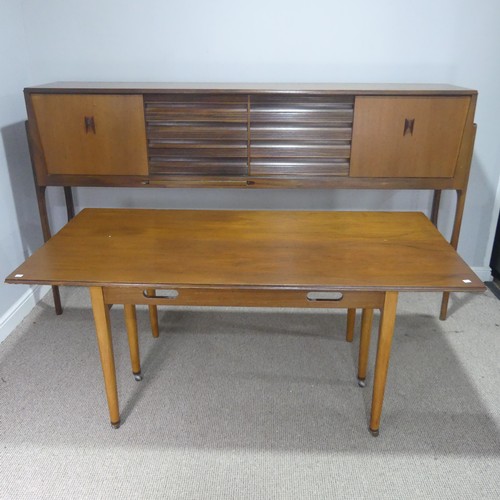 733 - A mid-20th century teak Elliots of Newbury sideboard dining room Set, the sideboard with retracting ... 