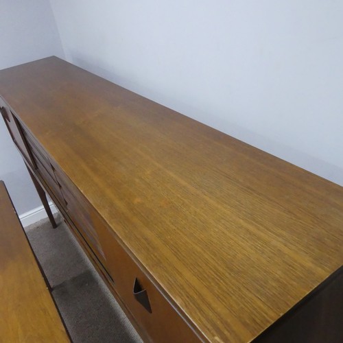 733 - A mid-20th century teak Elliots of Newbury sideboard dining room Set, the sideboard with retracting ... 