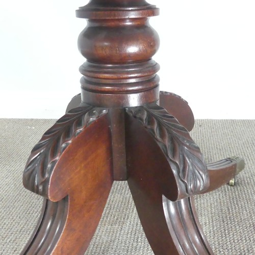 607 - A 19th century mahogany Pembroke Table, raised on turned column and carved splayed quadraform base, ... 